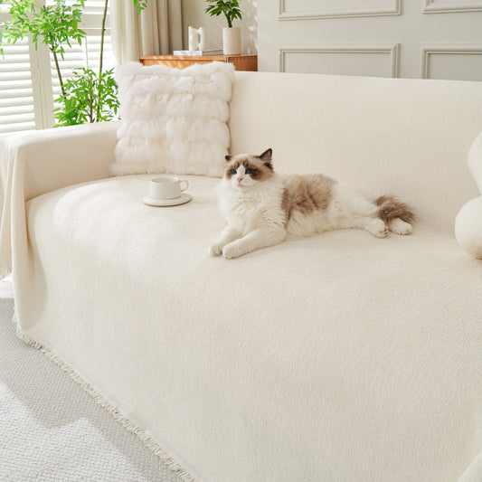 Soft gray sofa throw draped over a three seater couch
