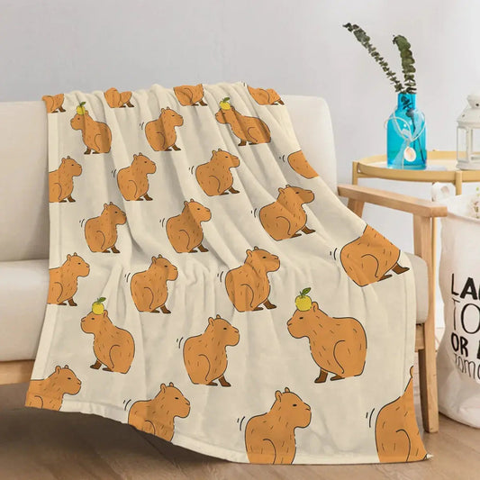 Capybara print flannel blanket draped on sofa