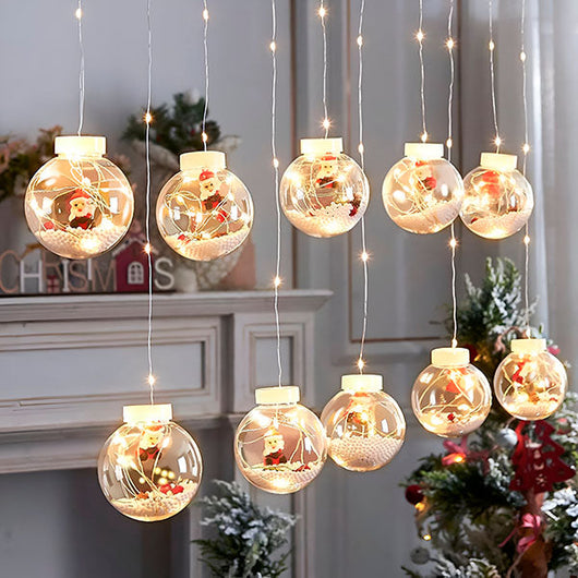 Christmas ball curtain lights glowing in a window