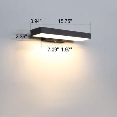 Motion sensor outdoor light mounted beside a garage door
