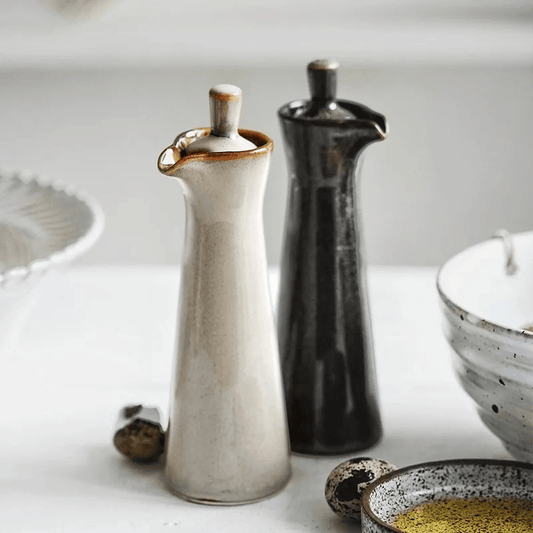 Run glaze drip pattern detail on stoneware oil dispenser