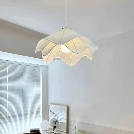 Pleated fabric pendant viewed from below showing tiered petal layers