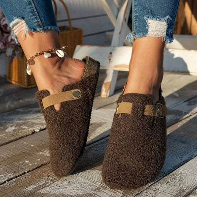 Faux shearling mule slippers worn indoors