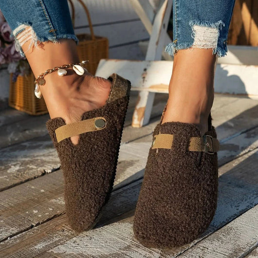 Faux shearling mule slippers worn indoors