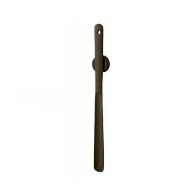 Long handle walnut wood shoehorn on magnetic wall mount
