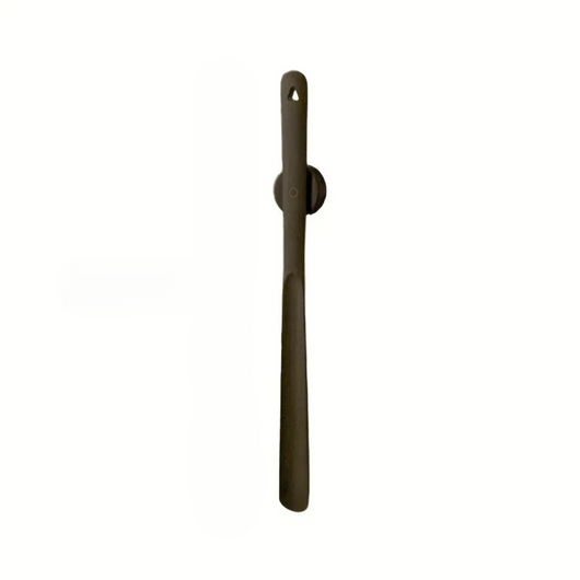 Long handle walnut wood shoehorn on magnetic wall mount