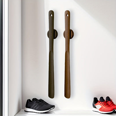 Wooden shoehorn snapped onto magnetic base in entryway