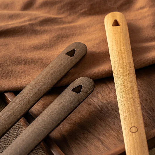 Wood shoehorn shown at full 50 cm length for scale