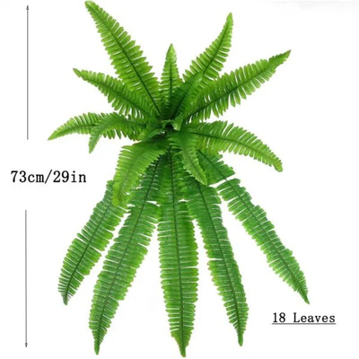 Artificial green fern displayed in decorative pot entryway