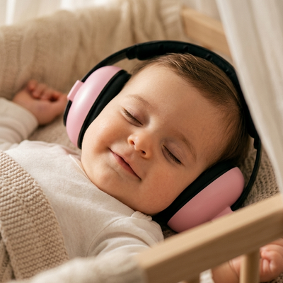 Pink baby ear muffs sleeping newborn nursery