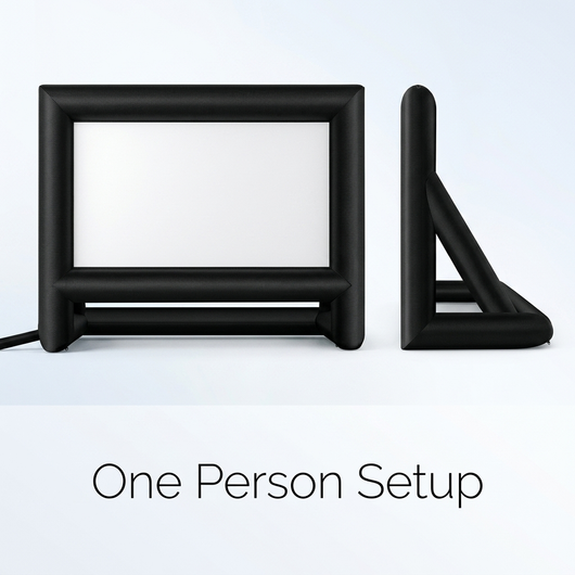 One person setting up the inflatable outdoor projector screen