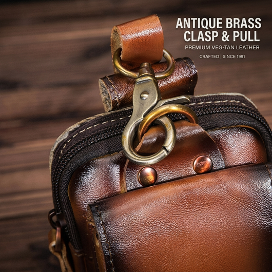 Dark brown leather waist pack worn at waist showing strap fit