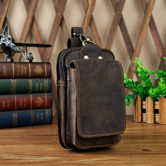 Dark brown leather waist pack leather grain and stitching close-up
