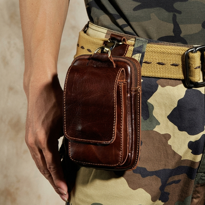 Dark brown leather waist pack interior storage detail