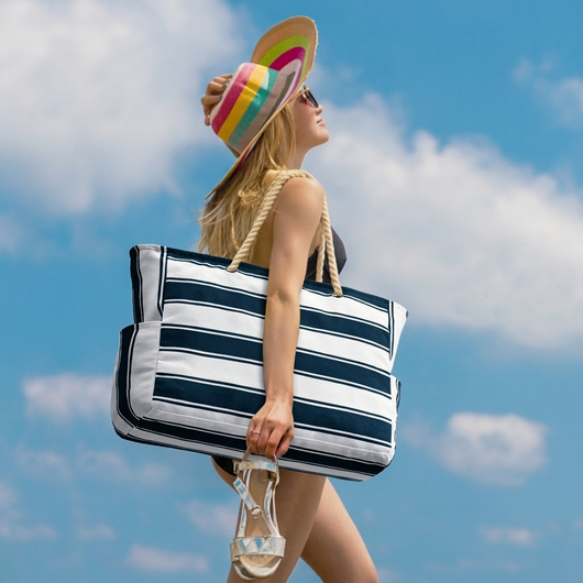 Gray beach tote packed with towels and beach gear