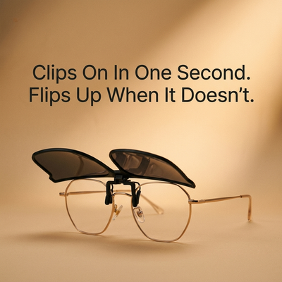 Clip-on polarized sunglasses on sand background with brand headline text
