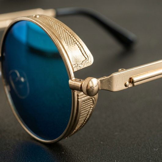 Close-up of the gold alloy frame hinge and brow bar detail