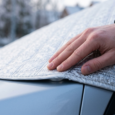 Close-up of the magnetic edge and elastic hem pressed against the car body
