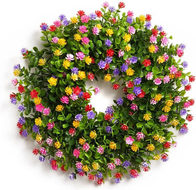 Eucalyptus and blossom wreath hung on a front door