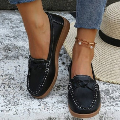 Soft leather look slip-on loafers close up stitching and elasticized collar