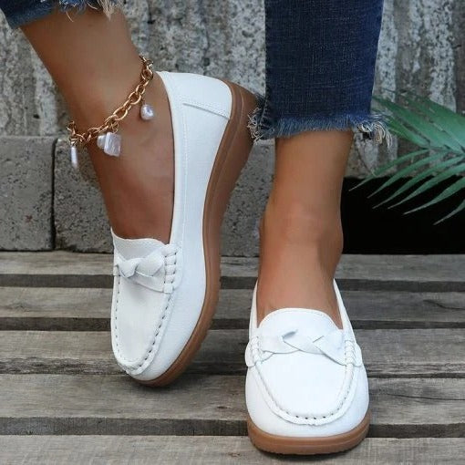 Slip-on loafers for women shown in multiple colors black blue red orange white